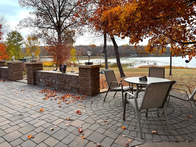 view of patio / terrace with a water view