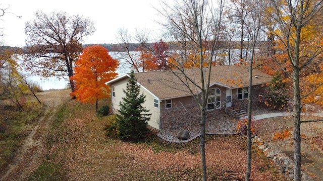 view of home's exterior featuring a water view