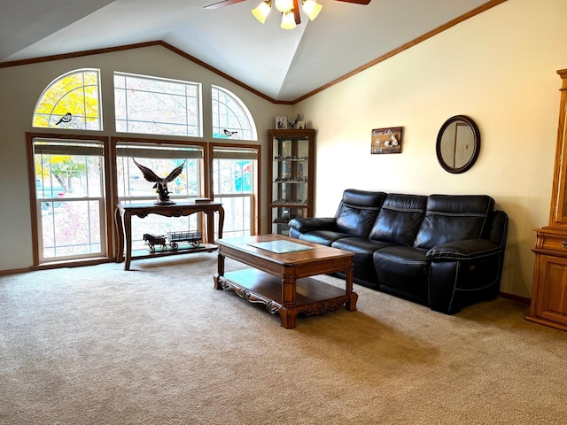 carpeted living room with ceiling fan and vaulted ceiling