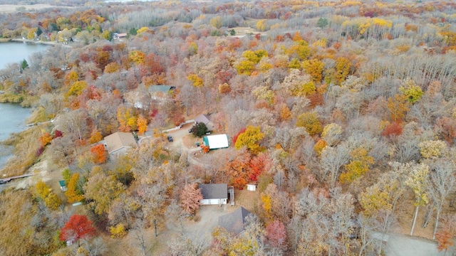 aerial view featuring a view of trees and a water view