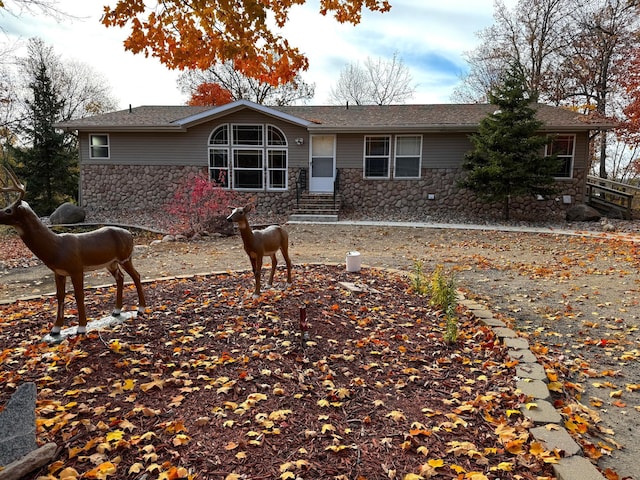 view of front of property featuring stone siding and entry steps