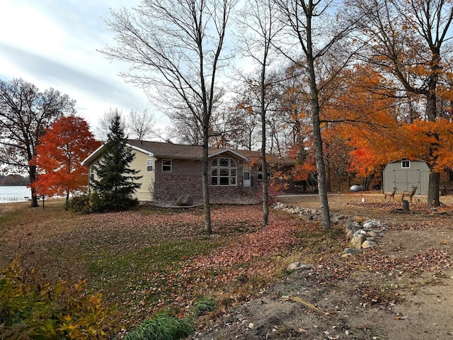 exterior space featuring an outbuilding and a storage unit