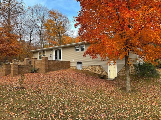 back of house featuring fence