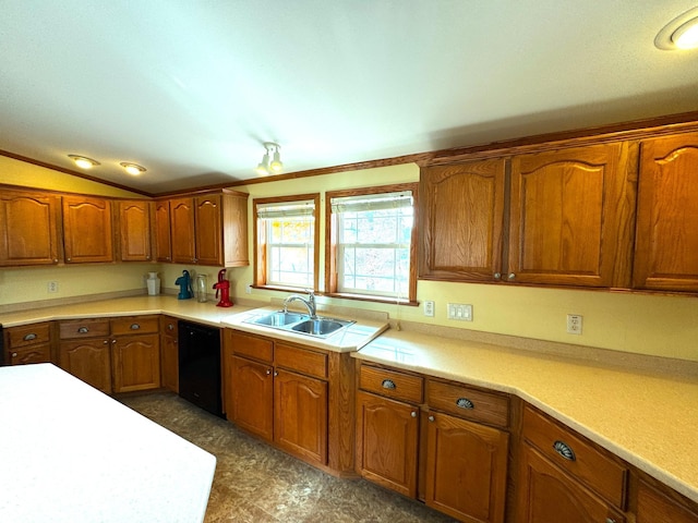 kitchen featuring brown cabinetry, light countertops, black dishwasher, and a sink