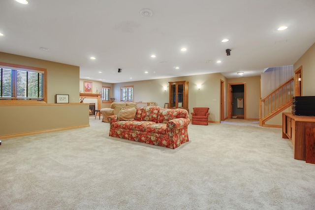 living room with light carpet and plenty of natural light