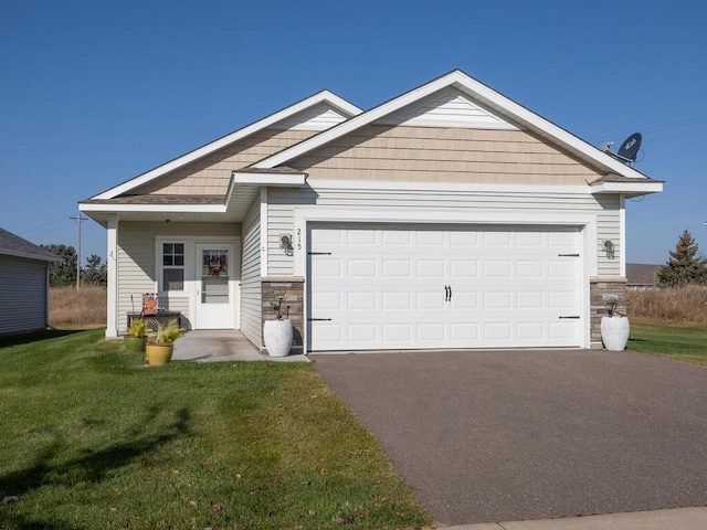 view of front facade featuring a front lawn and a garage