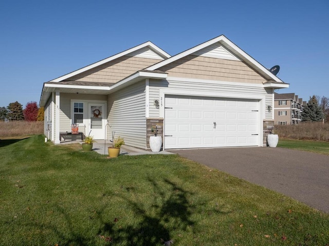 view of front of home featuring a garage and a front lawn