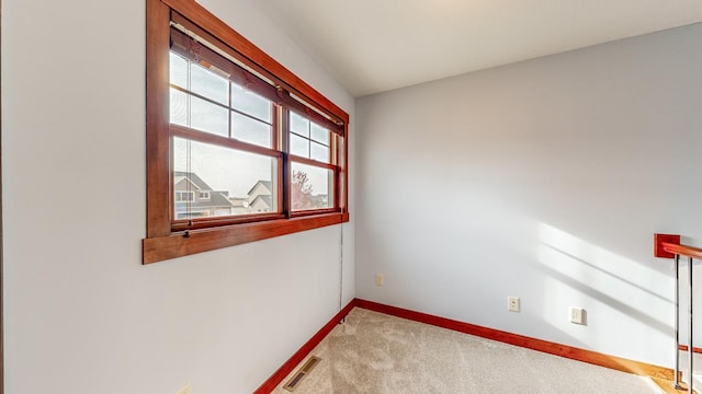 unfurnished room featuring carpet floors