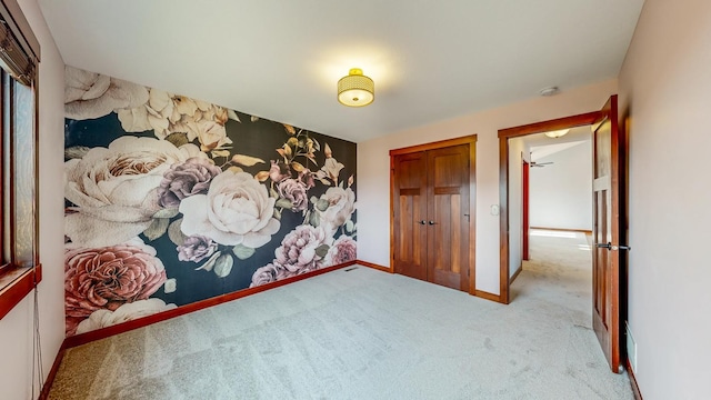 unfurnished bedroom featuring light colored carpet