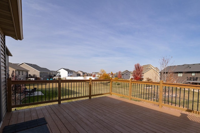 wooden deck with a yard