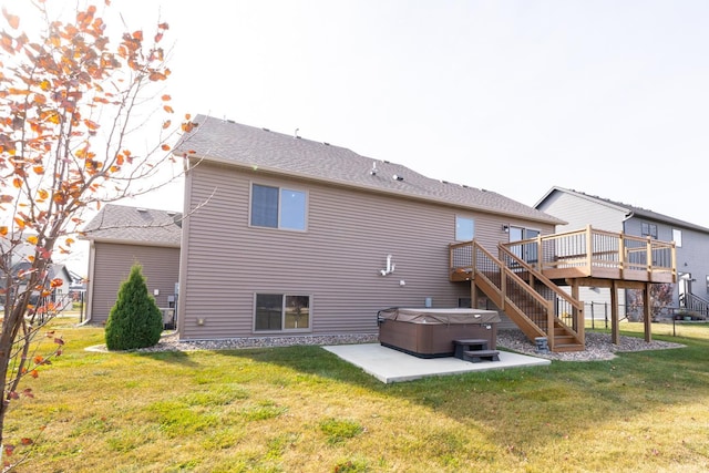 rear view of property with a patio area, a deck, and a yard