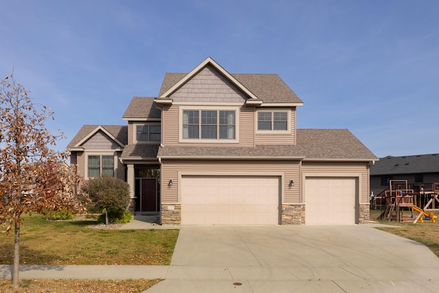 craftsman inspired home featuring a front yard and a garage