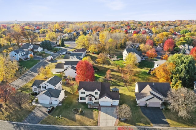 birds eye view of property with a residential view