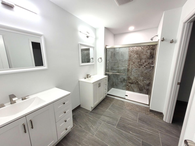 bathroom featuring vanity and a tile shower