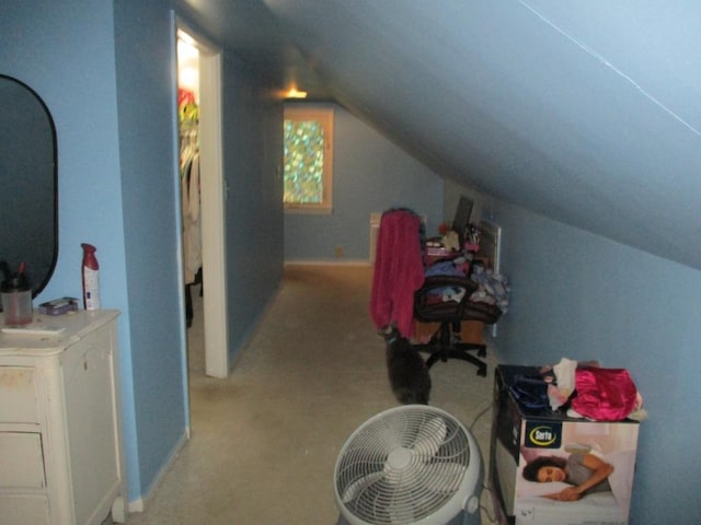 interior space featuring lofted ceiling and light colored carpet