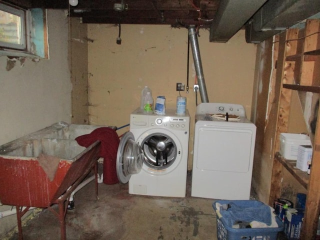 clothes washing area featuring washing machine and clothes dryer