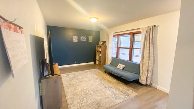 sitting room with hardwood / wood-style flooring