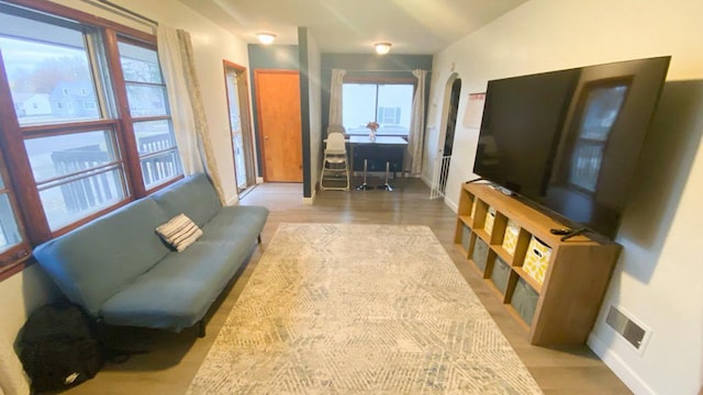 living room with light hardwood / wood-style floors