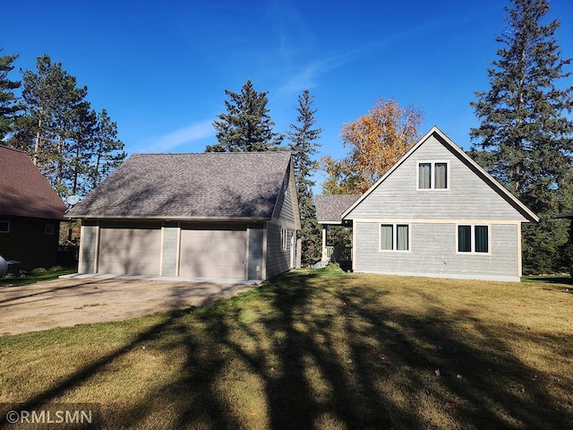 view of property exterior featuring a yard and a garage