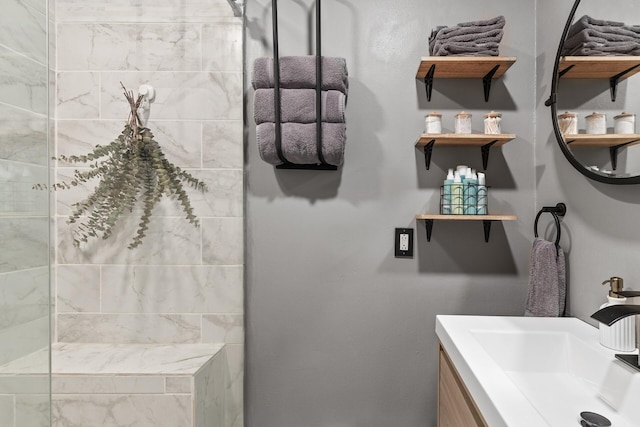 bathroom featuring vanity and a tile shower