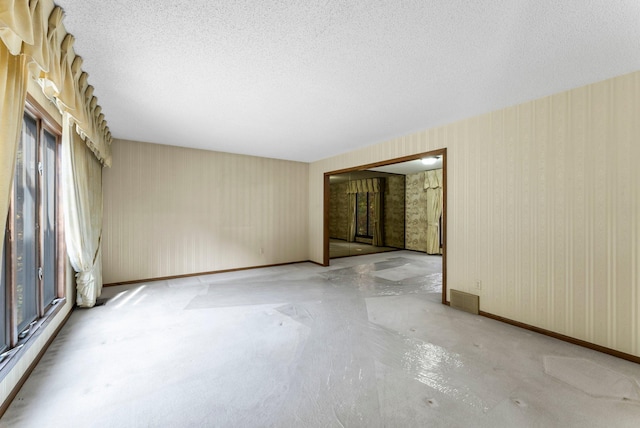 spare room featuring a textured ceiling