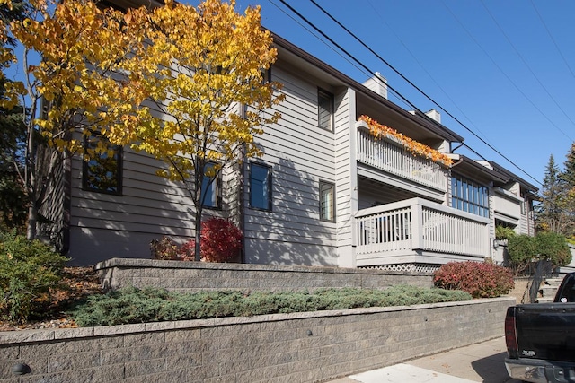 view of property exterior with a balcony