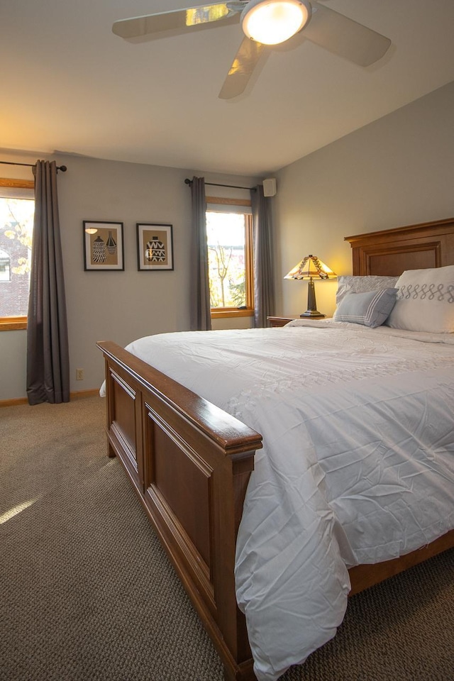 bedroom featuring light carpet and ceiling fan