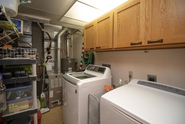 laundry area with washer and dryer and cabinet space