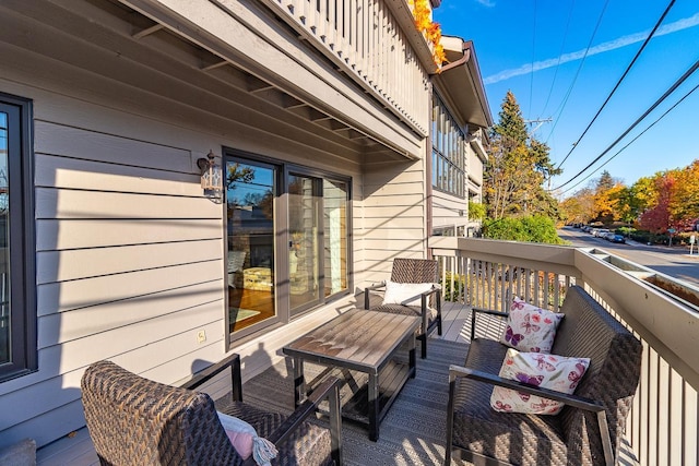 wooden deck featuring an outdoor living space