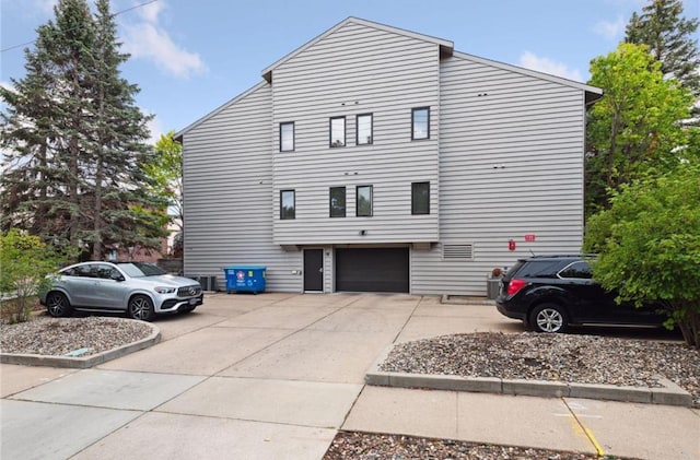 view of home's exterior featuring driveway and an attached garage