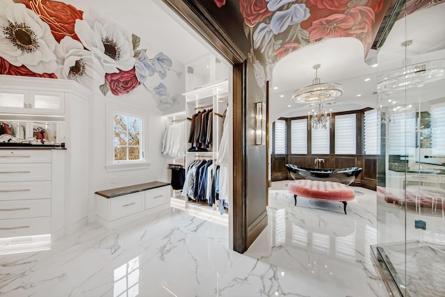 10675 Cavallo Rdg, Eden Prairie, MN 55347 - walk in closet featuring light marble finish floors and a chandelier