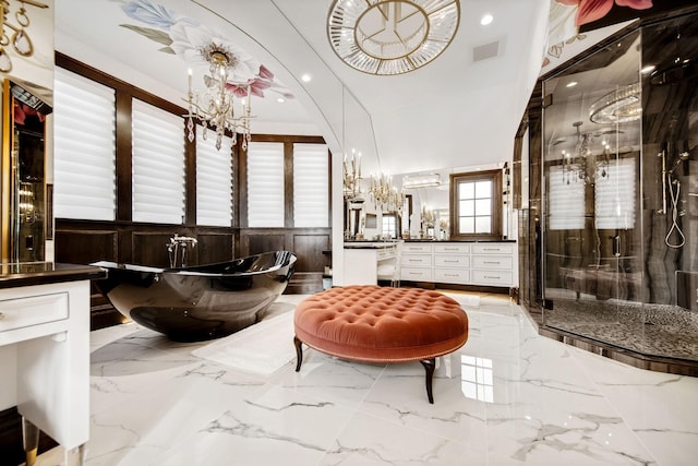10675 Cavallo Rdg, Eden Prairie, MN 55347 - bathroom featuring vanity, a soaking tub, a stall shower, marble tiled flooring, and a chandelier