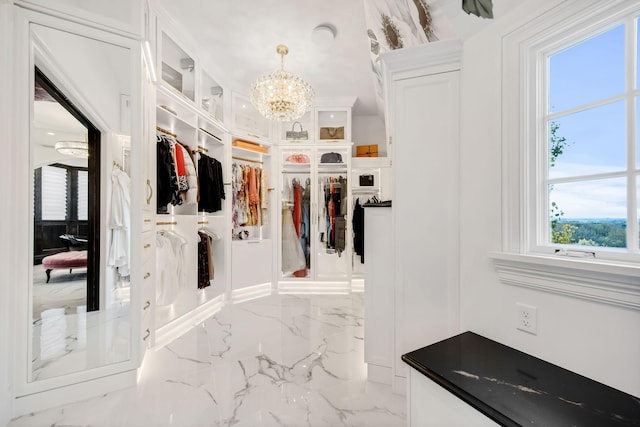 10675 Cavallo Rdg, Eden Prairie, MN 55347 - spacious closet with a chandelier and marble tiled flooring