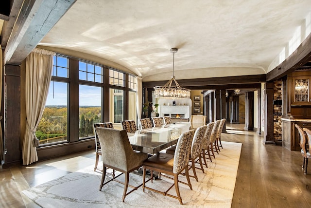 10675 Cavallo Rdg, Eden Prairie, MN 55347 - dining room with vaulted ceiling, a chandelier, and hardwood / wood-style flooring