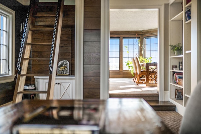 10675 Cavallo Rdg, Eden Prairie, MN 55347 - dining space with plenty of natural light, a textured ceiling, and stairs