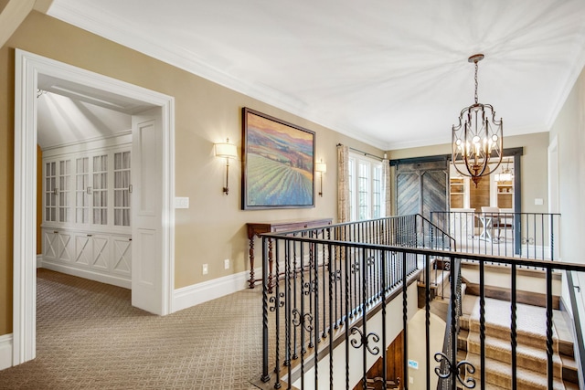 10675 Cavallo Rdg, Eden Prairie, MN 55347 - hallway with a chandelier, an upstairs landing, carpet, and crown molding
