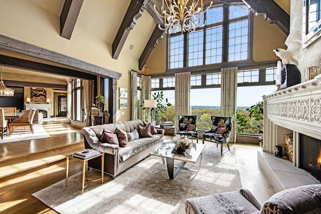 10675 Cavallo Rdg, Eden Prairie, MN 55347 - living area featuring a high end fireplace, a chandelier, high vaulted ceiling, beam ceiling, and hardwood / wood-style flooring