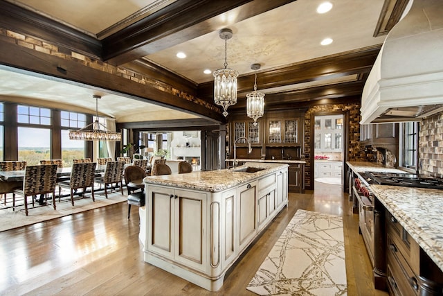 10675 Cavallo Rdg, Eden Prairie, MN 55347 - kitchen featuring custom exhaust hood, a chandelier, stainless steel stove, wood-type flooring, and beam ceiling