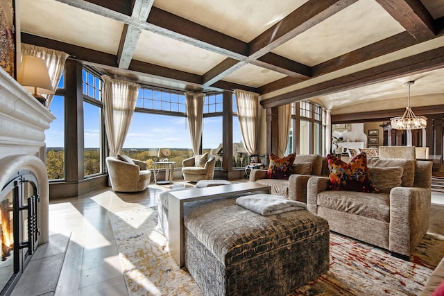 10675 Cavallo Rdg, Eden Prairie, MN 55347 - living area with a chandelier, coffered ceiling, beam ceiling, a lit fireplace, and wood finished floors