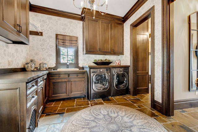 10675 Cavallo Rdg, Eden Prairie, MN 55347 - laundry room with separate washer and dryer, stone tile flooring, crown molding, cabinet space, and wallpapered walls