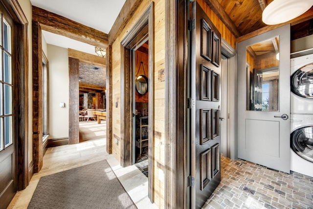 10675 Cavallo Rdg, Eden Prairie, MN 55347 - laundry area with stacked washer / drying machine and brick patterned floors