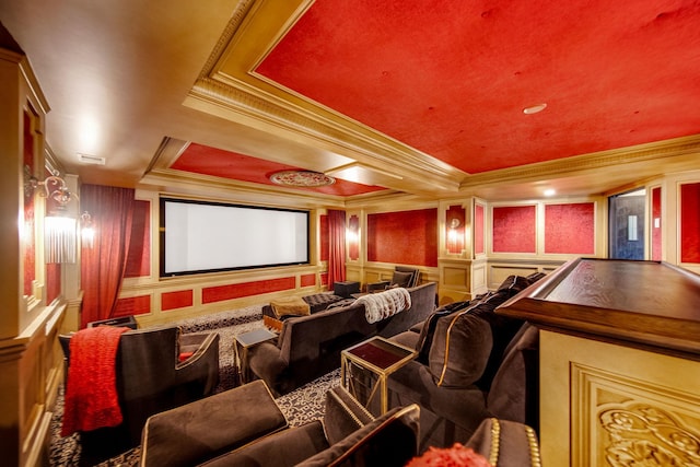 10675 Cavallo Rdg, Eden Prairie, MN 55347 - home theater featuring a decorative wall, ornamental molding, a tray ceiling, carpet, and a wainscoted wall
