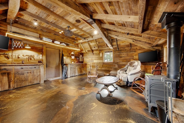 10675 Cavallo Rdg, Eden Prairie, MN 55347 - living area with a wood stove, wooden ceiling, wood walls, and finished concrete floors