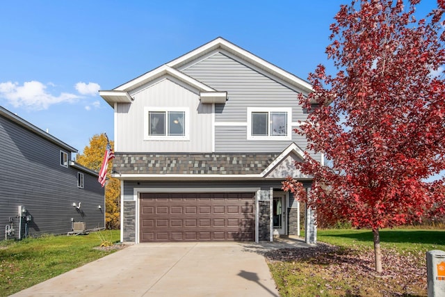 view of front property featuring a front yard and a garage