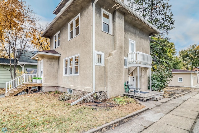 view of property exterior featuring a balcony