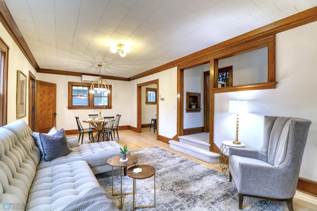 living room with a chandelier, crown molding, and light hardwood / wood-style floors