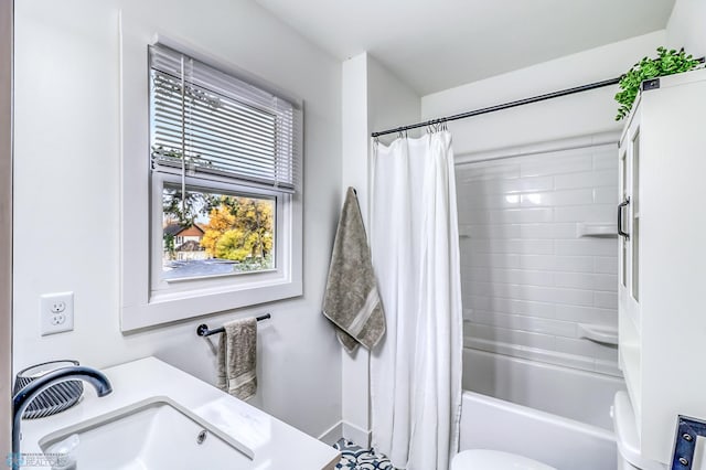 full bathroom with toilet, shower / bathtub combination with curtain, and vanity