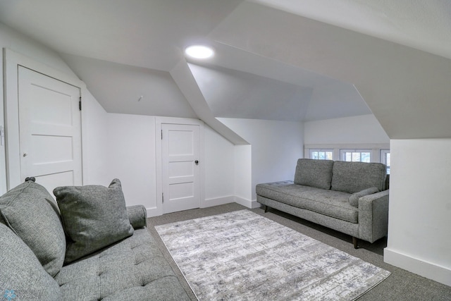 living room featuring vaulted ceiling and carpet floors