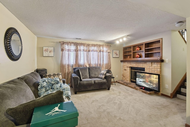 carpeted living room with a textured ceiling and a brick fireplace