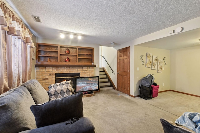 living room featuring a textured ceiling, a fireplace, and light carpet